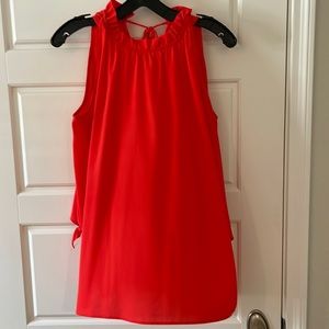 Tomato red “cold shoulder” blouse